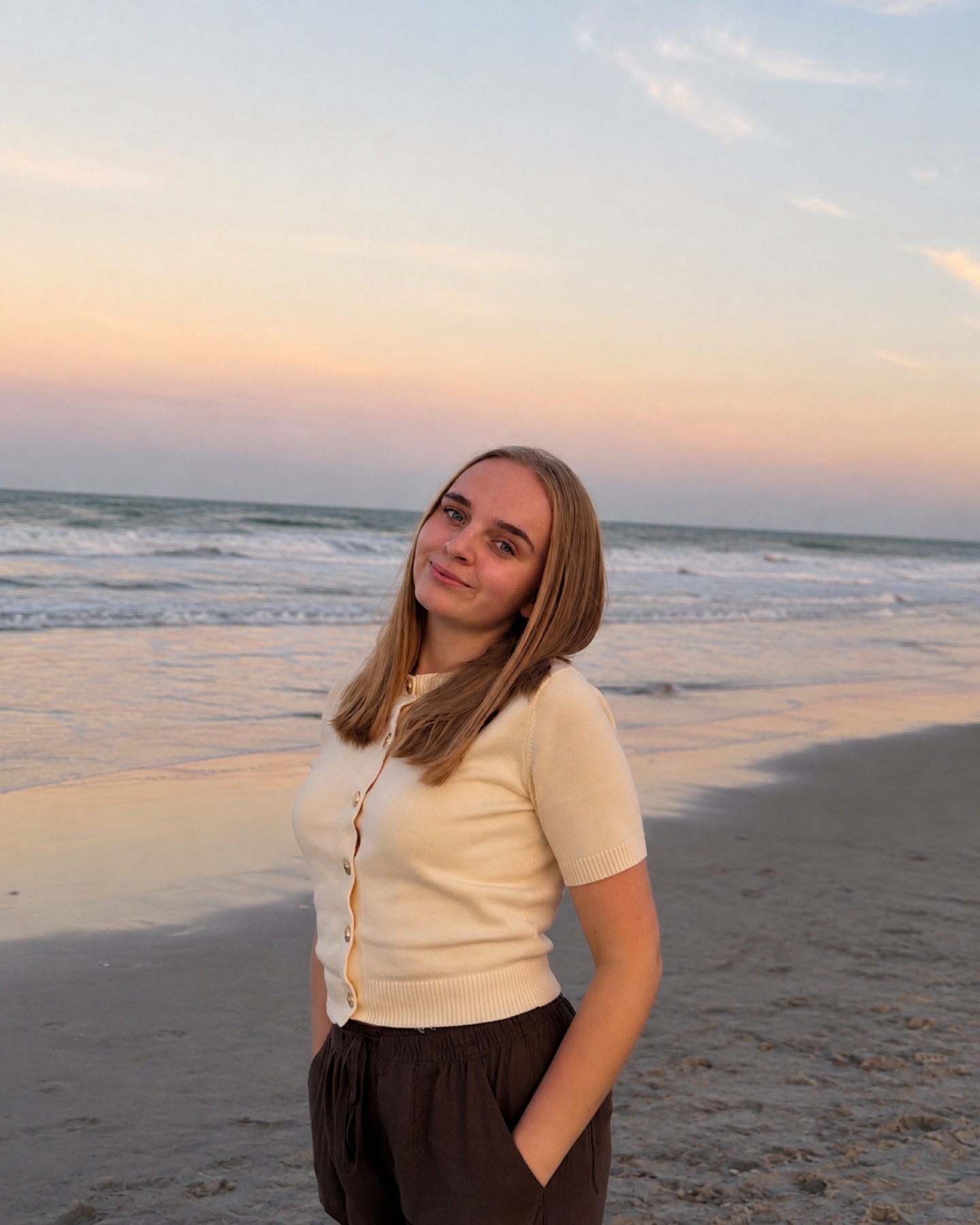 Risilda Abeshi at a Florida beach at sunset